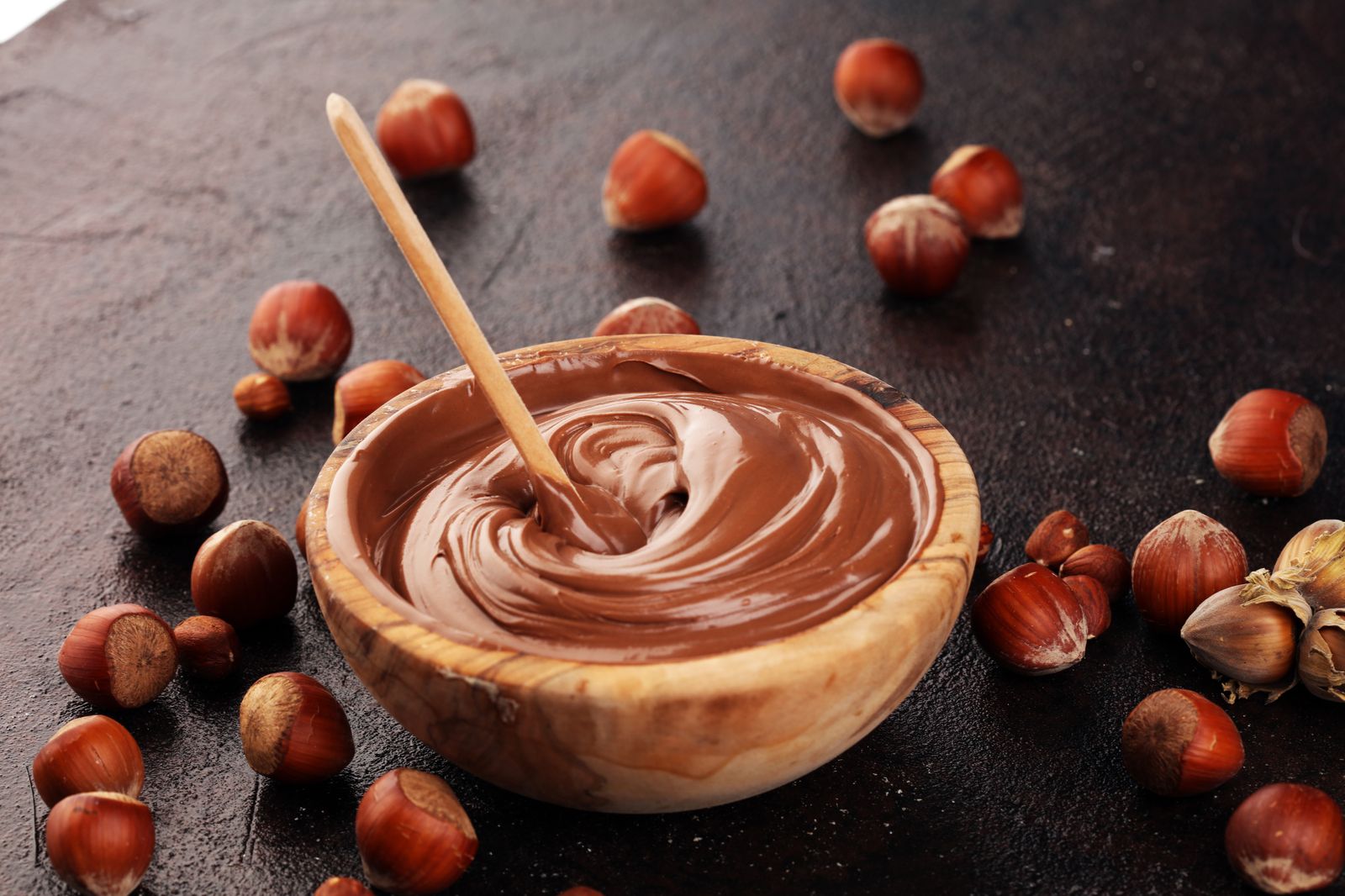Smooth hazelnut cream in a wooden bowl